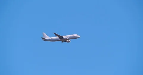 4K - Tracking airplane in the sky Stock Footage 88989818