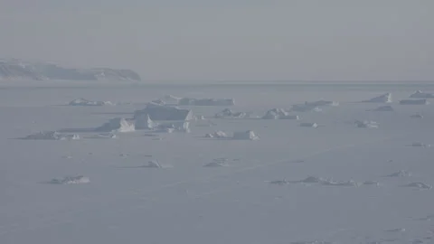 4K Tracking Drone Shot of Icebergs in Frozen Seascape Stock Footage 314514161
