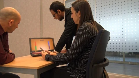 4K Tracking Shot Young Group Of Business People Using Computer At Meeting Stock Footage 121614647