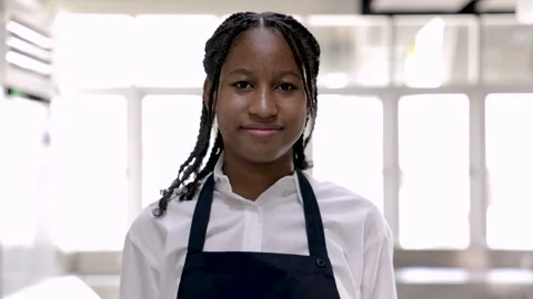 4K tracking view, portrait of young smiling African student walking to came.. Stock Footage 246757270