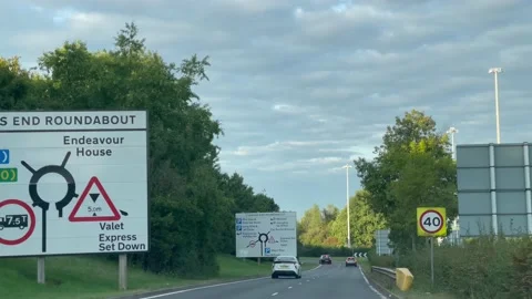 4K traffic Coopers End Roundabout towards Stansted Airport, express Set down Stock Footage 214035345