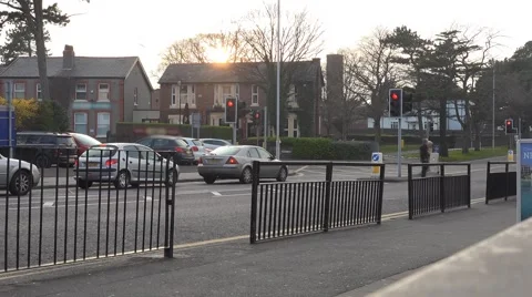 4k traffic light junction time lapse at rush hour with sun setting in background Stock Footage 48992462