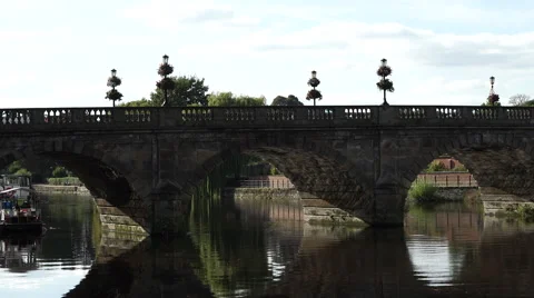 4K traffic passes over pretty bridge on sunny day - long version Stock Footage 56557295