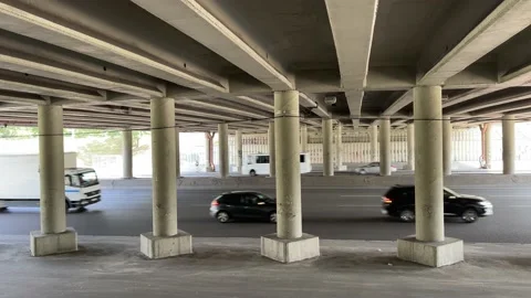 4k Traffic under the bridge during daytime. Slow motion. Stock Footage 158475374