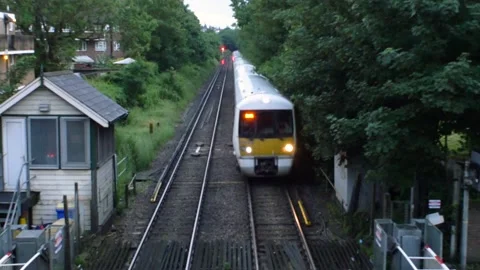 4K Train Passing Under In London Near Forest Video stock 188538308