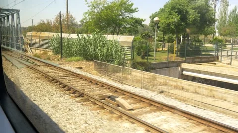 4k train view from window going through bridge and passing by fast train Video stock 49987192