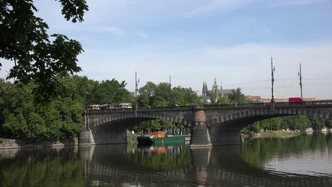 4K Tramway cross bridge in central city of Prague Vitus cathedral landmark view Stock Footage 72171058