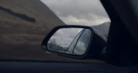 4K Travellers Car Side View Mirror within The Glen Coe Scottish Mountains. Stock Footage 93077957