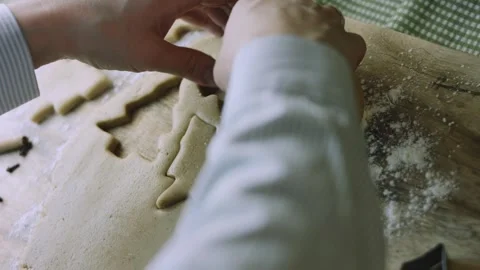 4K Tree and Star Cutters Forming Festive Gingerbread Cookies Stock Footage 342113435