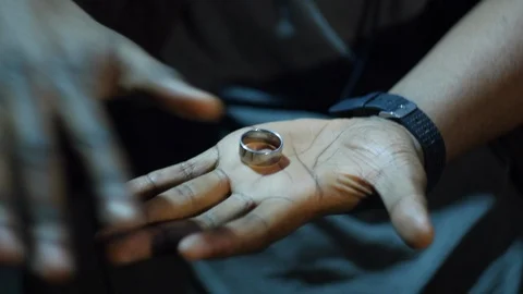 4K Trick of putting ring on the finger Video stock 98211025
