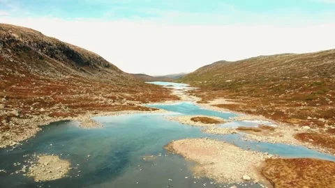 4k tundra drone, alpine stream footage, rocky valley river Stock Footage 309274636