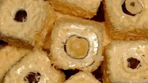 4k – Turkish delight with nuts and coconut shaving on plate 02 Stock Footage 56007236