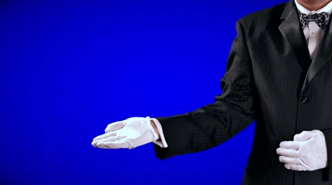4K Tuxedo Man Gestures, Open Hand Reveal to Center Screen, Blue Background Stock Footage 66289772