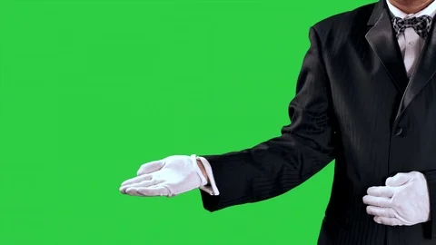 4K Tuxedo Man Gestures, Open Hand Reveal to Center Screen, Green Screen Video stock 72363062