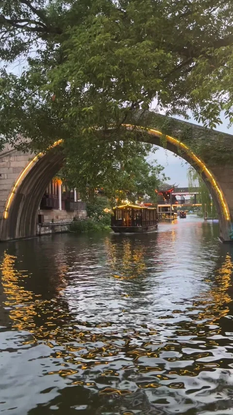 4K Twilight Illuminated Stone Bridge Boat Nanxun Stock Footage 346353446