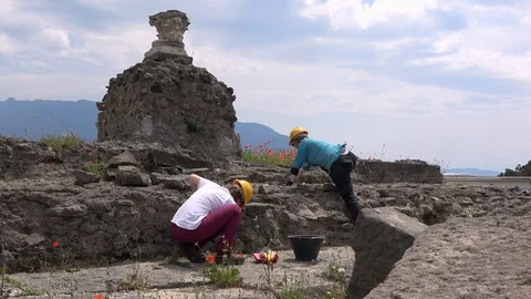 4K. Two archaeologists are working on an excavation in Pompeii, Italy-Adrian Stock Footage 93760323