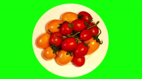 4k two branches of yellow and red tomatoes cherry on plate Stock Footage 49663172