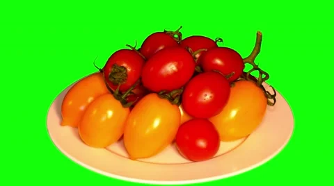 4k two branches of yellow and red tomatoes cherry on plate Stock Footage 49751690