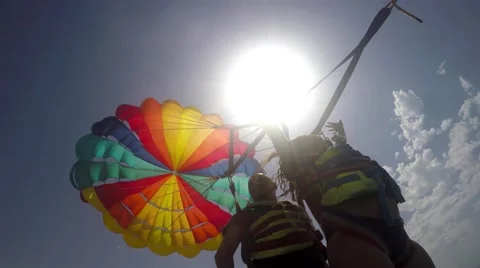 4k Two duplex paragliders paragliding under sun Stock-Footage 56034325