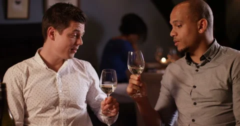 4k, two friends in a restaurant toasting wine glasses. Stock Footage 62912857