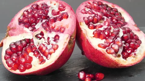 4K - Two halves of a pomegranate. Close-up Video stock 165895368
