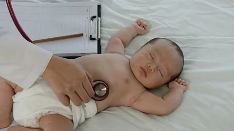 4K, Two-month-old newborn undressed in a white bed in hospital Stock Footage 170124406