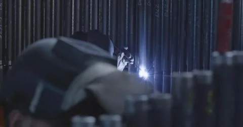 4K Two workers welding a steel pipes Stock Footage 37212048