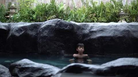 4k Two young asian boy talk and relax in hot water onzen Stock Footage 122101917