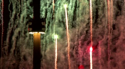 4K UHD - 60fps or 30fps - Red and green fireworks flying fast near tower Stock Footage 40904077