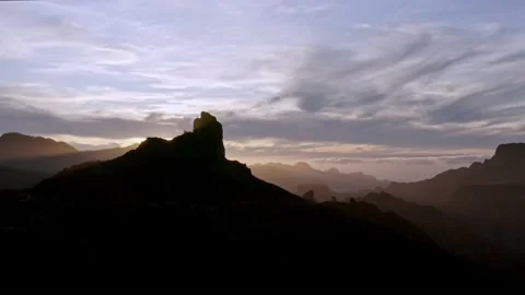 4K UHD | Aerial flight in mountain valley at sunset 動画素材 153036697