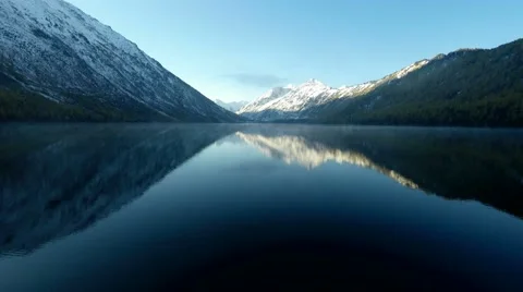 4K UHD Aerial Footage Backward Flight Above Foggy Mountain Lake Stock Footage 56958440