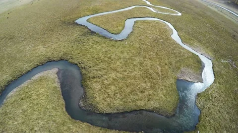 4K UHD Aerial High Angle Fisheye Shot of River Zigzags Stock Footage 56961909
