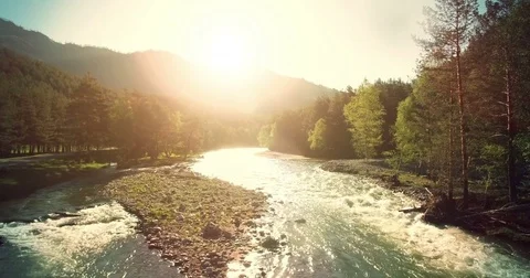 4k UHD aerial view. Low flight over fresh cold mountain river at sunny summer Stock Footage 69833581