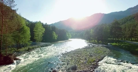4k UHD aerial view. Low flight over fresh cold mountain river at sunny summer Stock Footage 69837950