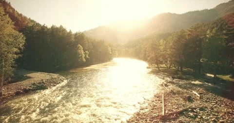 4k UHD aerial view. Low flight over fresh cold mountain river at sunny summer Stock Footage