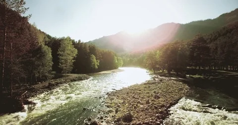 4k UHD aerial view. Low flight over fresh cold mountain river at sunny summer Stock Footage