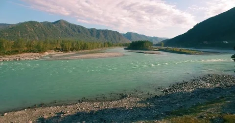 4k UHD aerial view. Low flight over fresh cold mountain river at sunny summer Stock Footage
