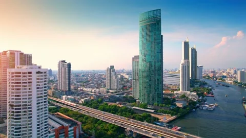 4K UHD : Aerial view over the Chao Phraya River and Buildings of Bangkok Stock Footage 173739367