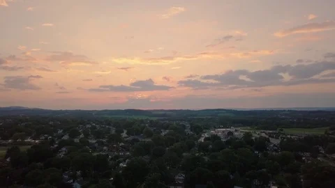 4k UHD Ariel push over a small suburb during sunset Stock Footage 78127737