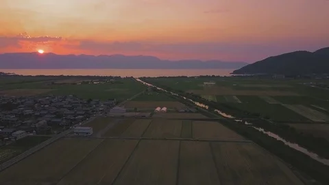4K UHD Beautiful Sunset Over Ricefields In Japan Aerial Footage Vídeo Stock 82280747