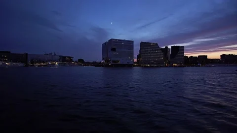 4K-UHD: Boad trip over Ij in Amsterdam, Netherland at night near a party boat Video stock 135345123