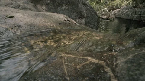 4K UHD Close up of a stream flowing over rock Video stock 62846516