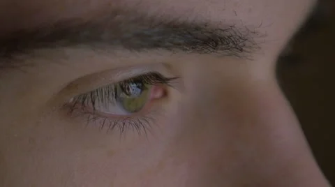 4k UHD - Close-up of a young man eyes browsing on a tablet pc Stock Footage 46817905