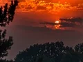 4K UHD Colorful clouds as the sun sets behind them - time lapse 4k or 4k+ Resolution