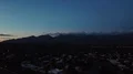 4K UHD drone dusk traffic xmas lights and lingering winter clouds on mountain 4k or 4k+ Resolution
