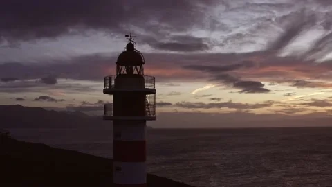 4K UHD | Drone Flight around Lighthouse at sunset 動画素材 153036770