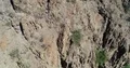 4K UHD drone rotation from cliff face to up river 4k or 4k+ Resolution