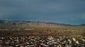 4K UHD drone soft pan left snow capped mountains grey skies 4k or 4k+ Resolution