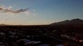 4K UHD drone sunset colors reflect on houses w subtle cloud and light traffic 4k or 4k+ Resolution