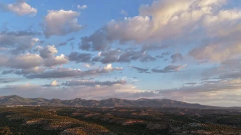 4K UHD Drone Timelapse: Morning Pastel Clouds Over Rugged Desert Mesas Stock Footage 337727358